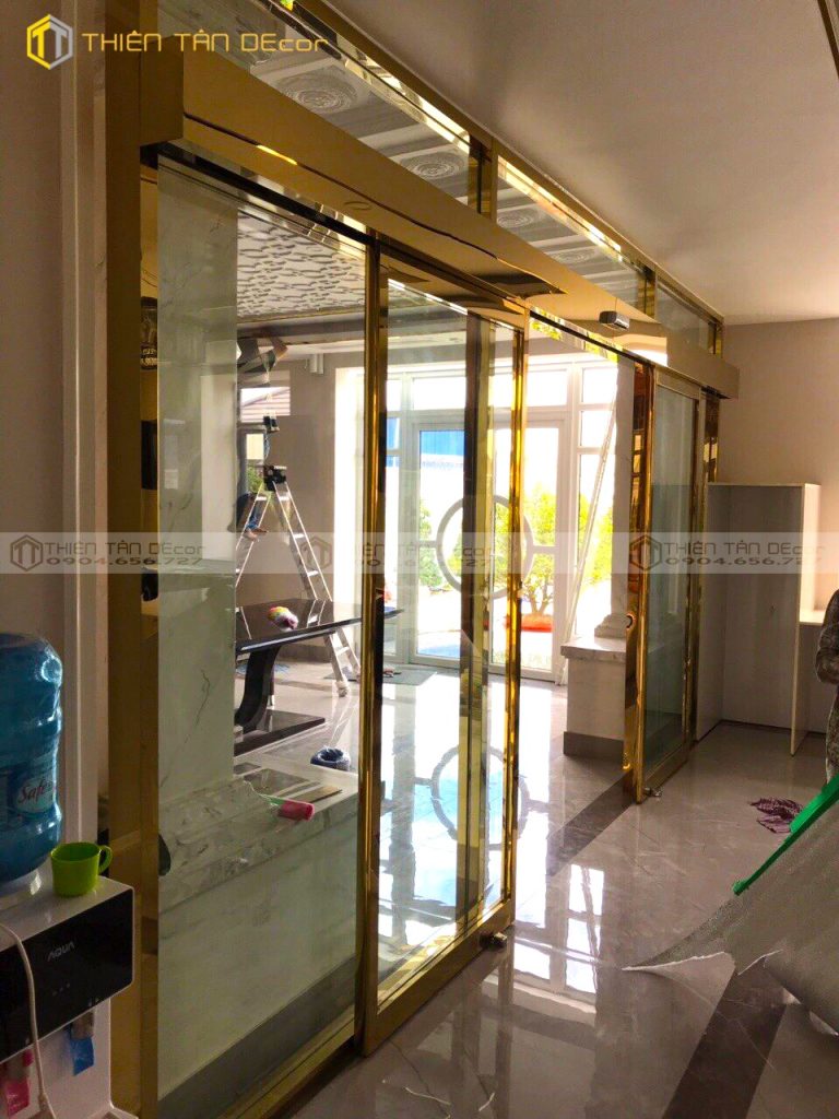 Gia công cửa lùa tự động inox mạ vàng